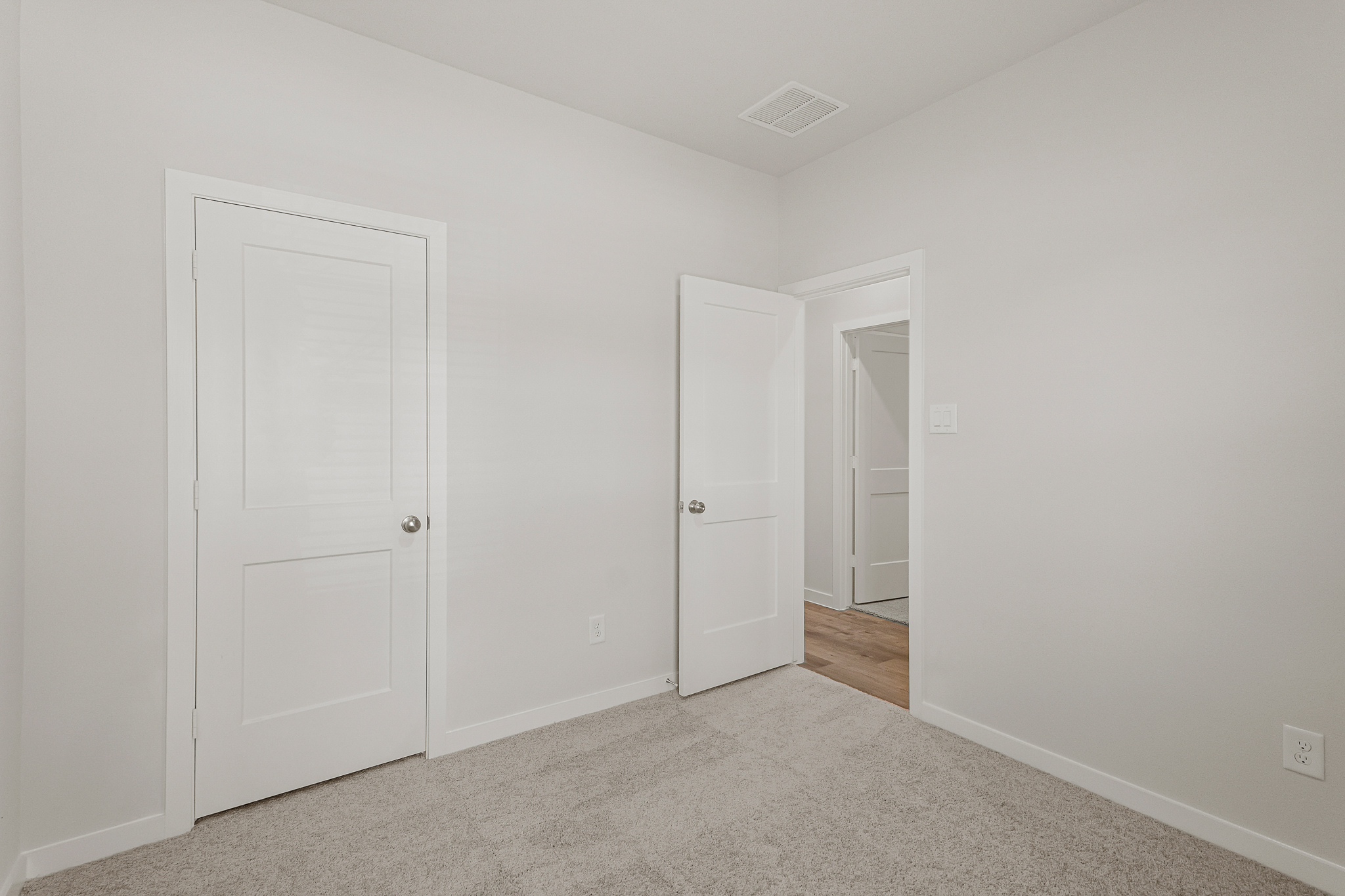 A room with white doors.