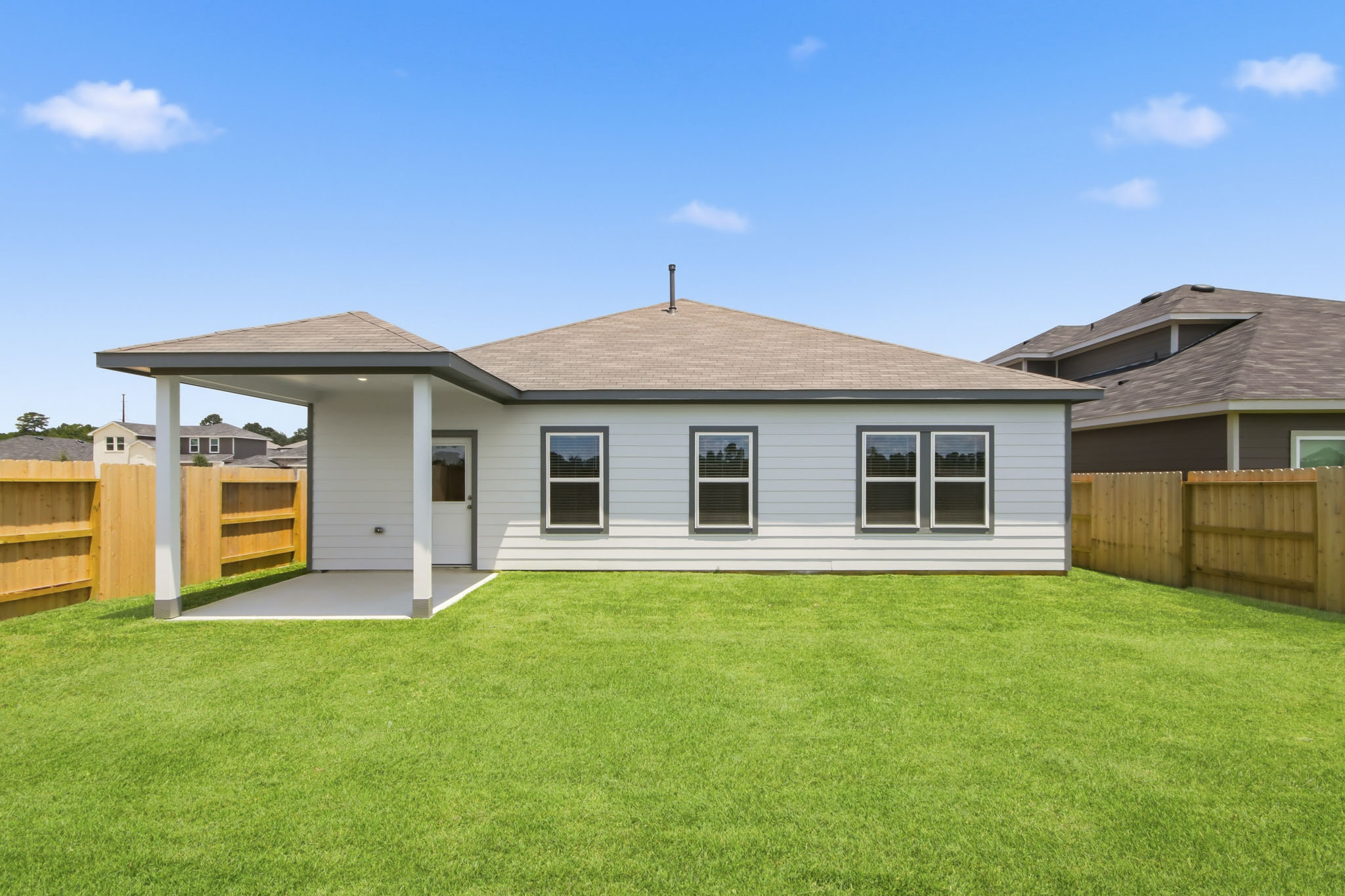 A house with a grass yard.