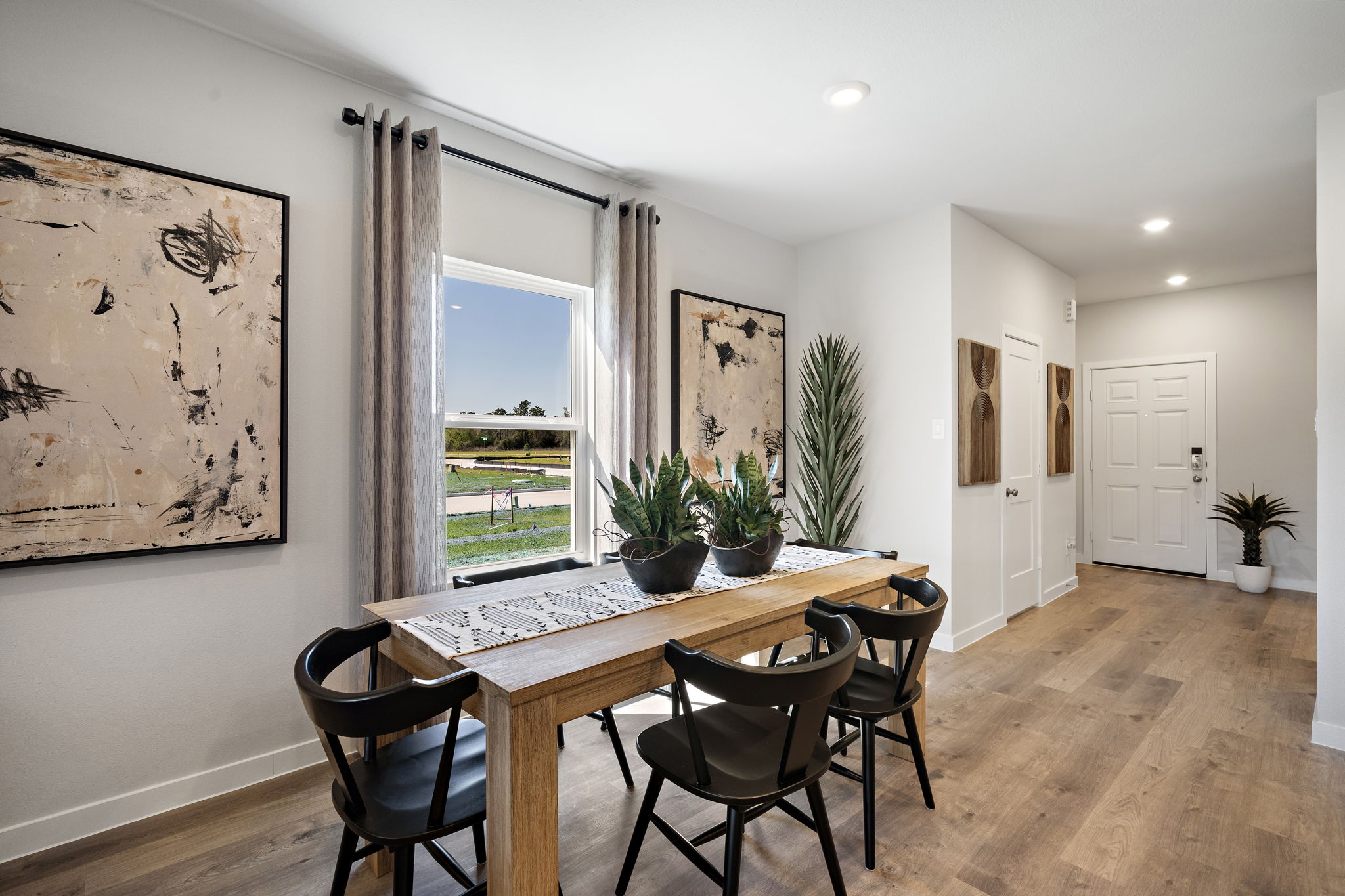 A dining room table with chairs.