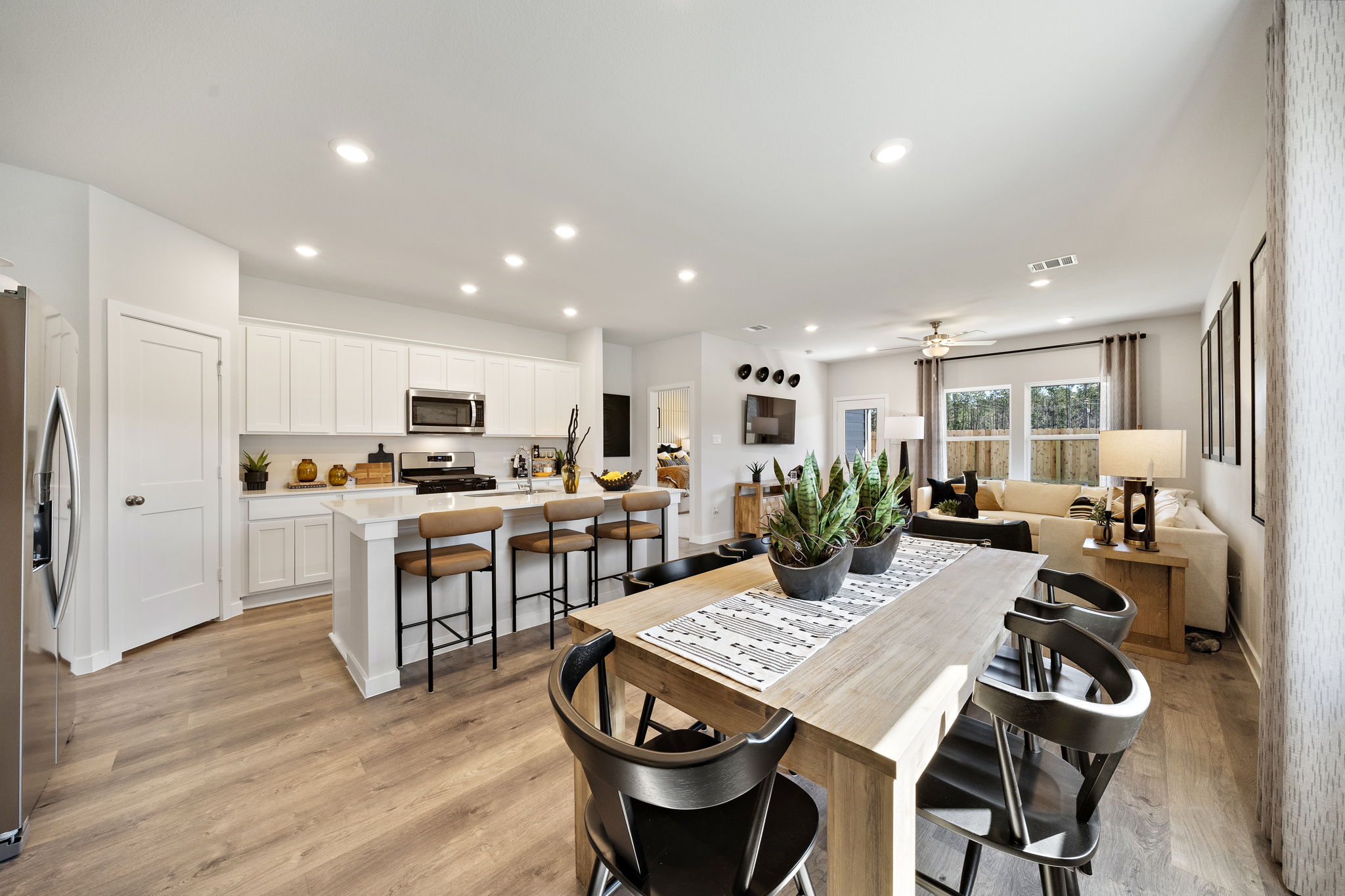 A kitchen with a dining table.