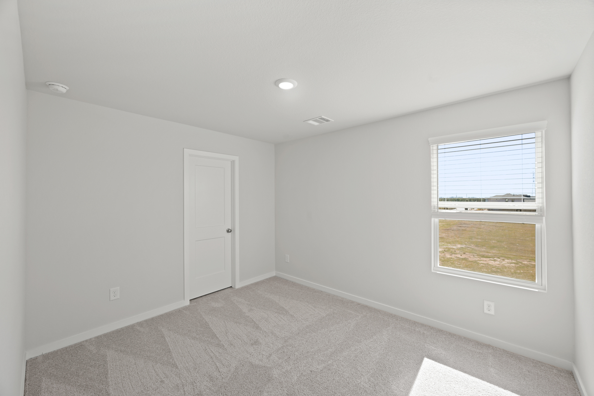 A room with a door and a window.