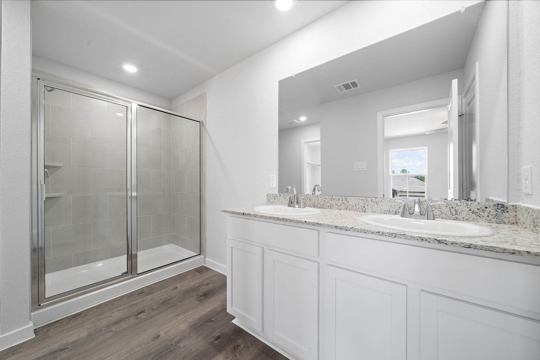 A bathroom with a glass shower.