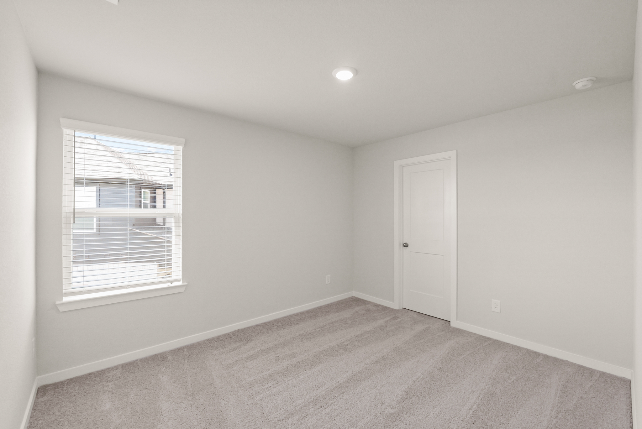 A room with a door and a window.