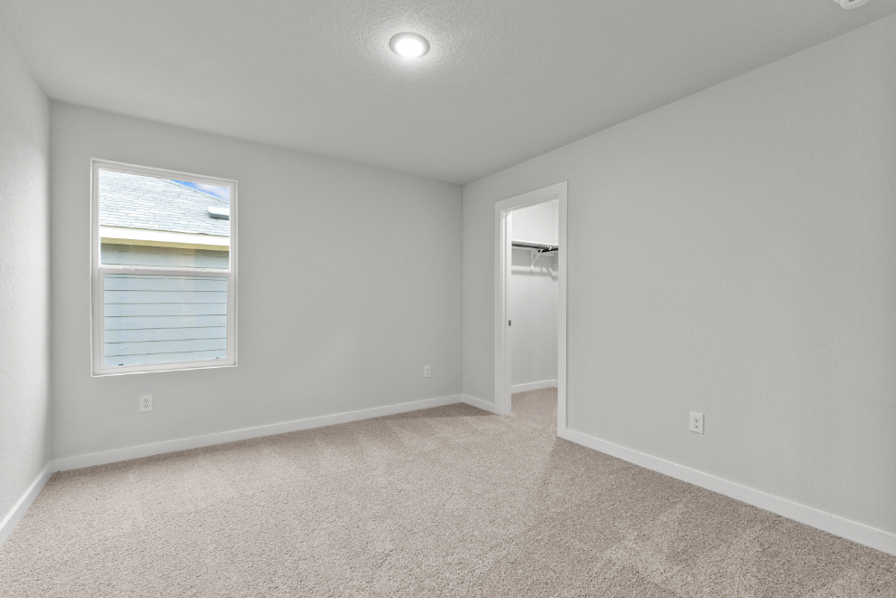 A room with a door and a window.