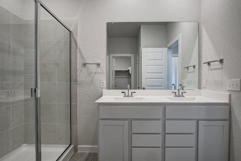 A bathroom with a glass shower.