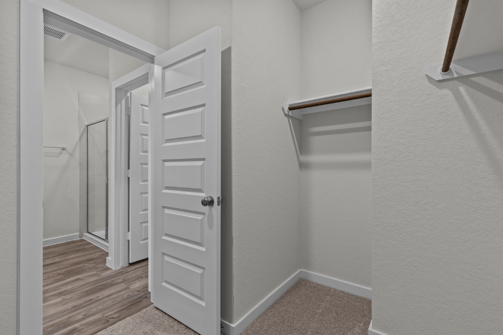 A white closet in a room.