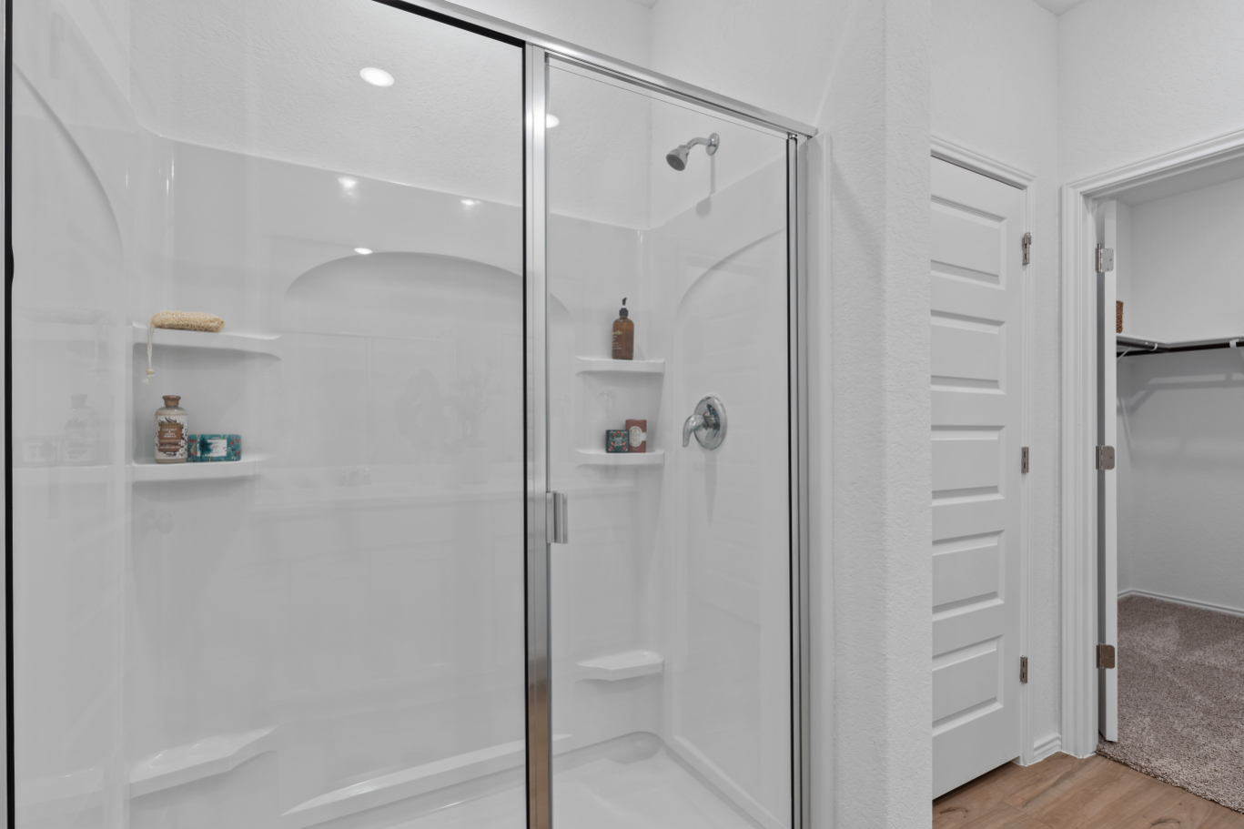 A bathroom with a glass shower.