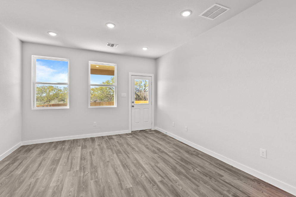 A room with white walls and windows.