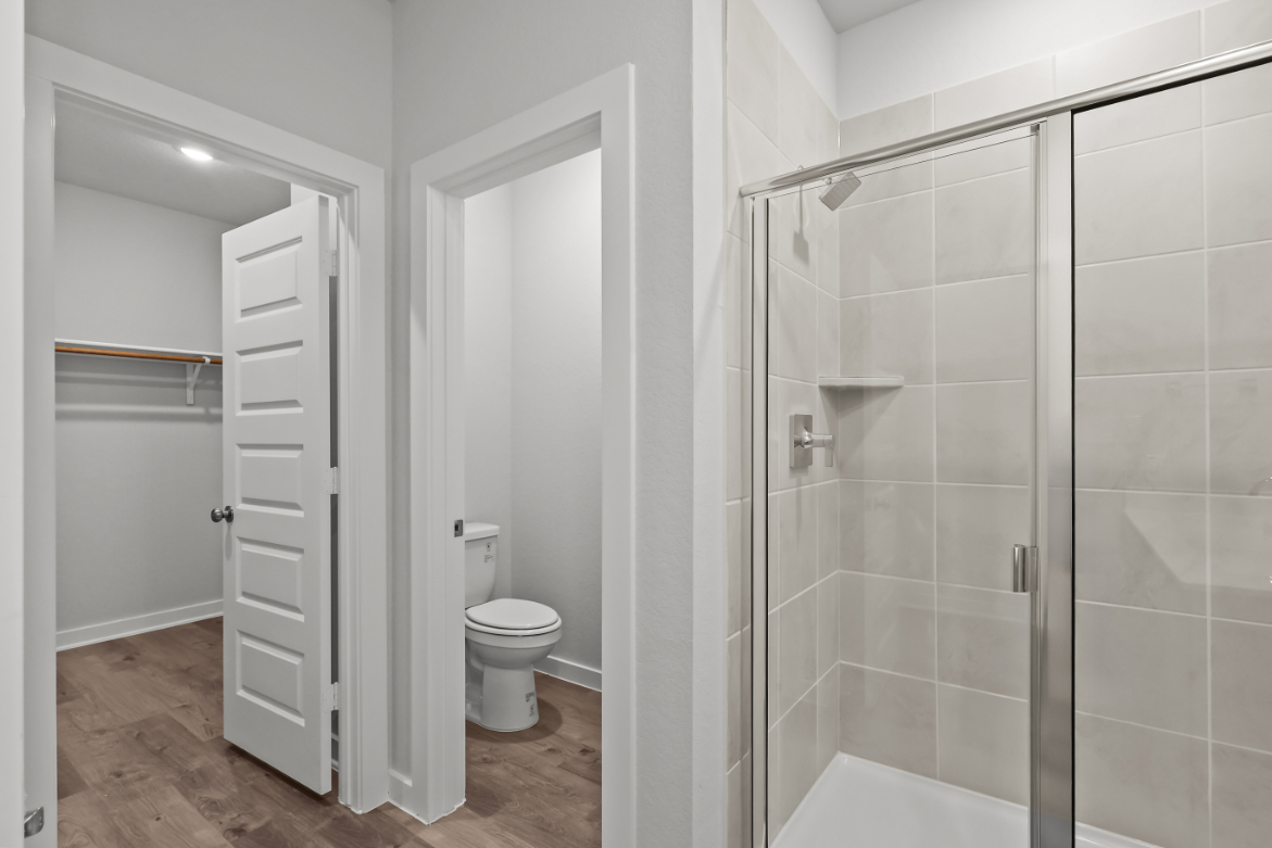 A bathroom with a glass shower.