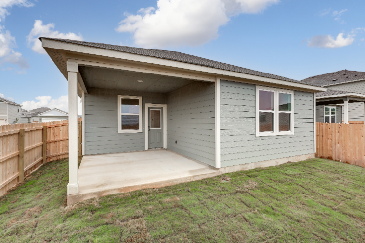 A white house with a fence.