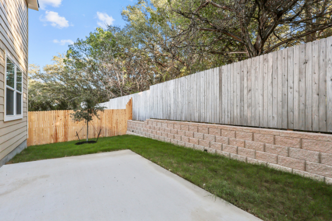 A driveway next to a house.