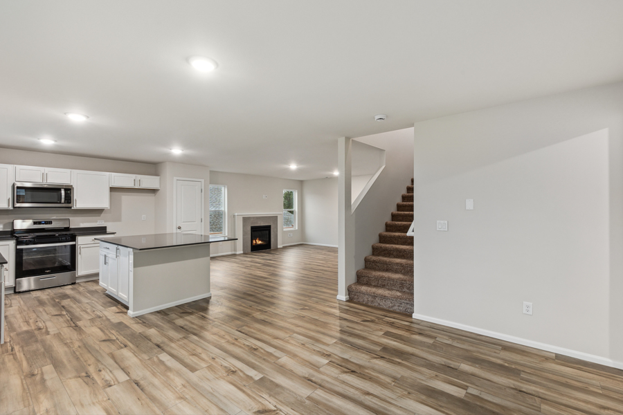 A large kitchen with white cabinets.