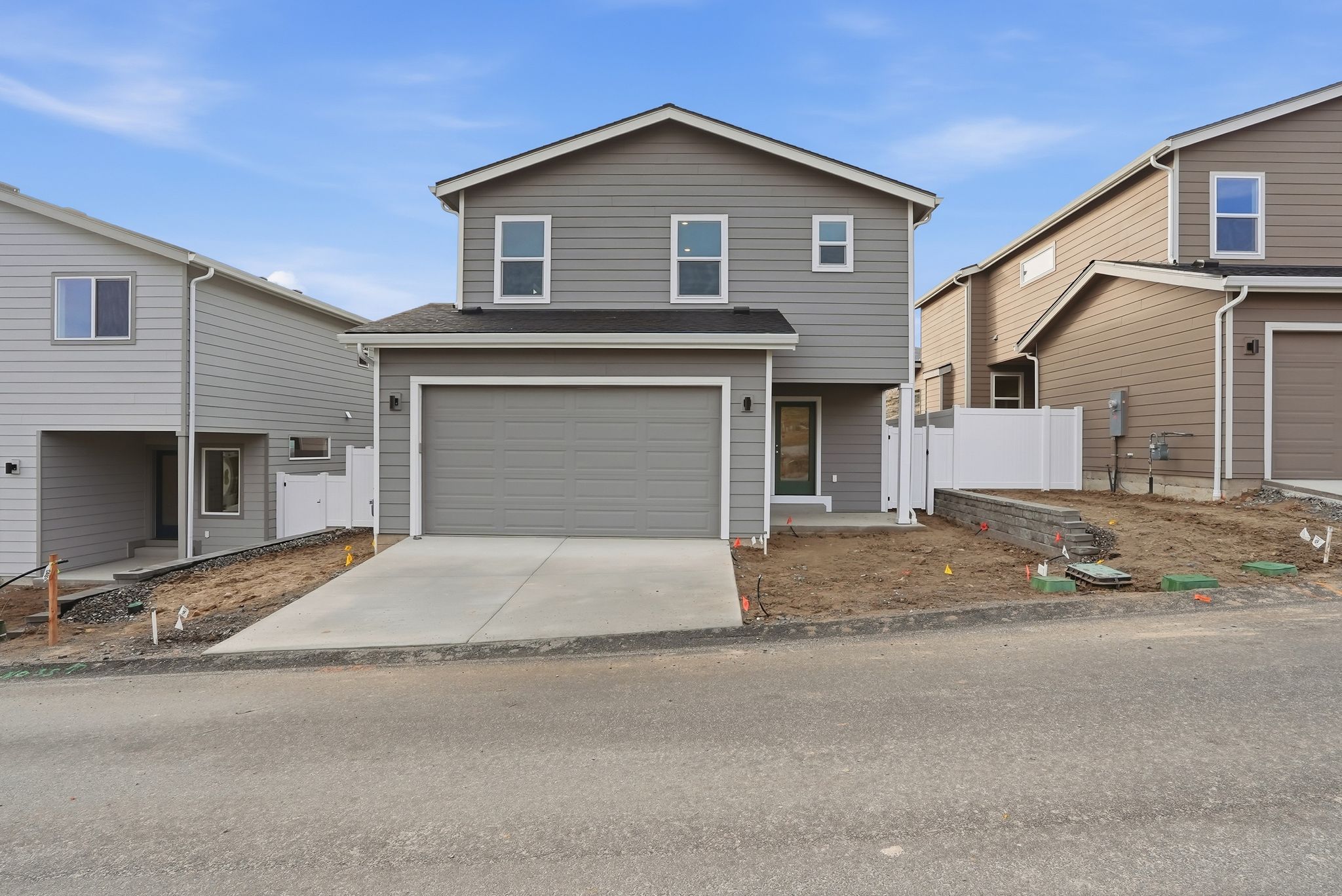 A house with garages and a driveway.