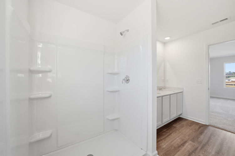 A bathroom with a glass shower.