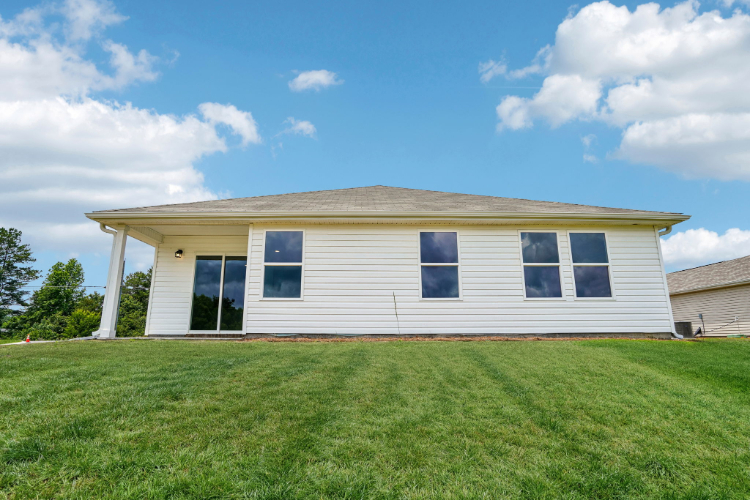 A house with a grass yard.