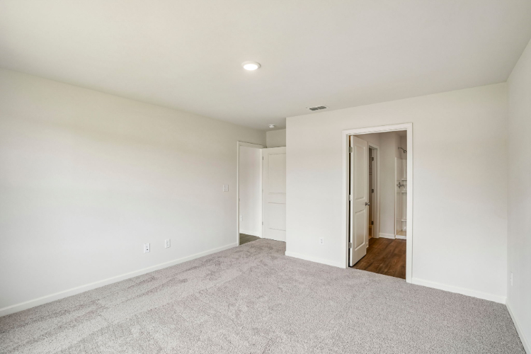 A hallway with white walls.